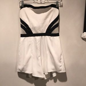 WHITE ROMPER W/ BLACK DETAILING